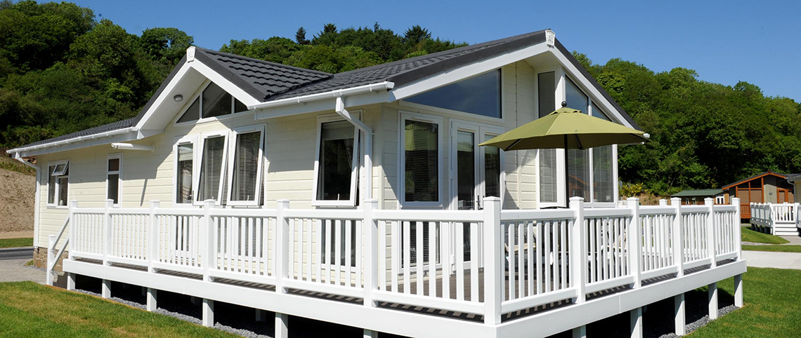 Exterior of the Arundel Twin lodge set on a beautiful holiday park.